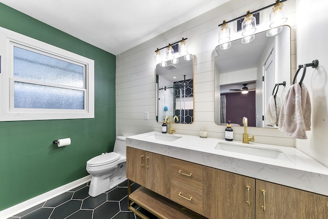 bathroom with tile patterned flooring, vanity, a shower, toilet, and ceiling fan