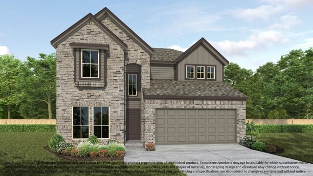 view of front of property with a garage and a front yard