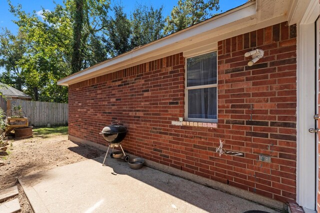 view of property exterior featuring a patio area