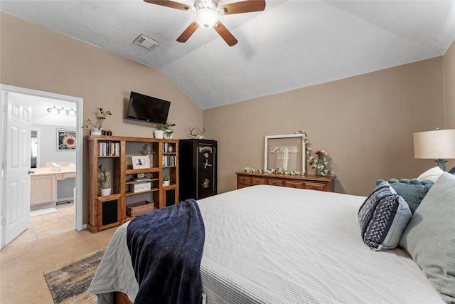 carpeted bedroom featuring ceiling fan, connected bathroom, and lofted ceiling