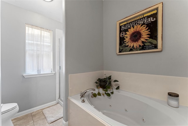 bathroom featuring toilet, tile patterned floors, and separate shower and tub