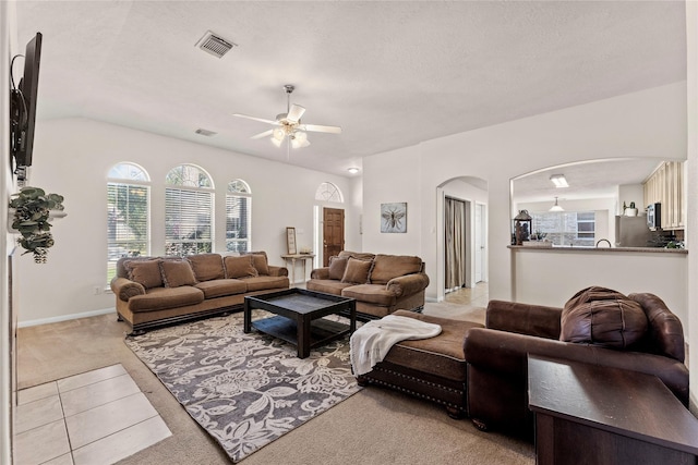 living room with light carpet and ceiling fan