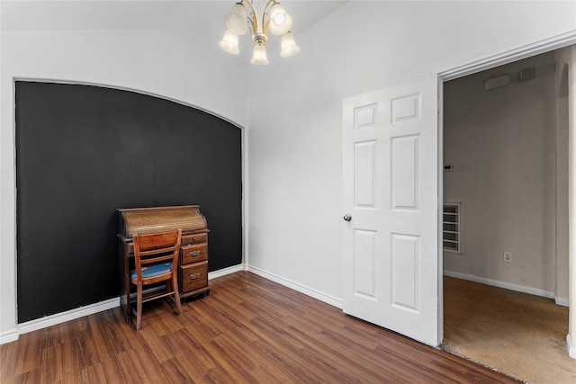 home office featuring vaulted ceiling, dark hardwood / wood-style flooring, and a chandelier