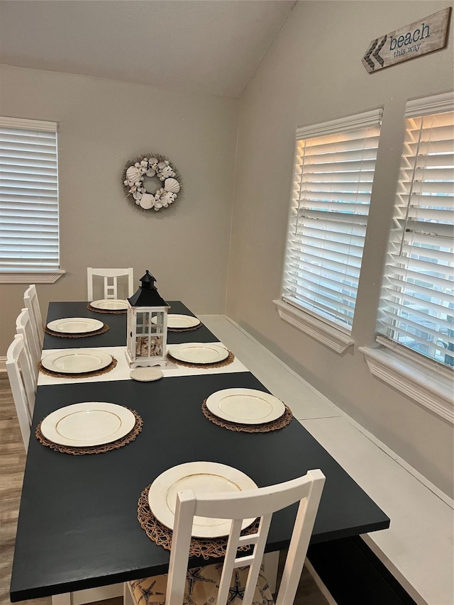 dining room with vaulted ceiling