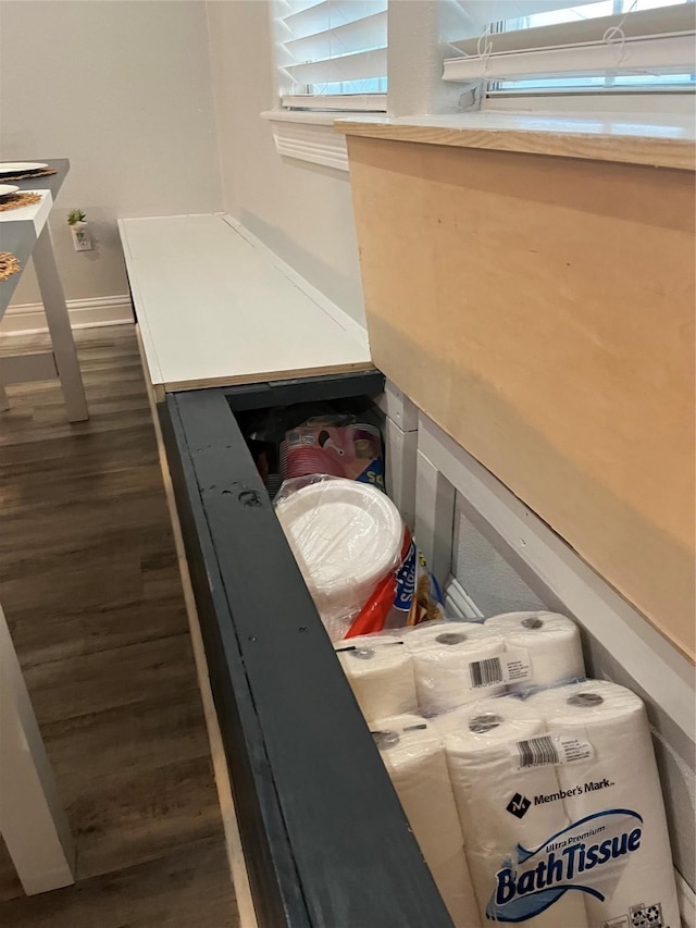 room details featuring baseboards and wood finished floors