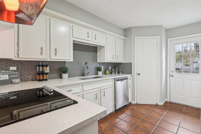 kitchen with black electric stovetop, decorative backsplash, dishwasher, white cabinets, and sink