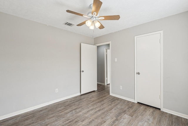 unfurnished bedroom featuring ceiling fan and light wood-type flooring