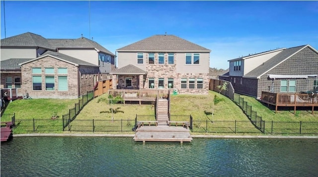 dock area featuring a water view and a yard