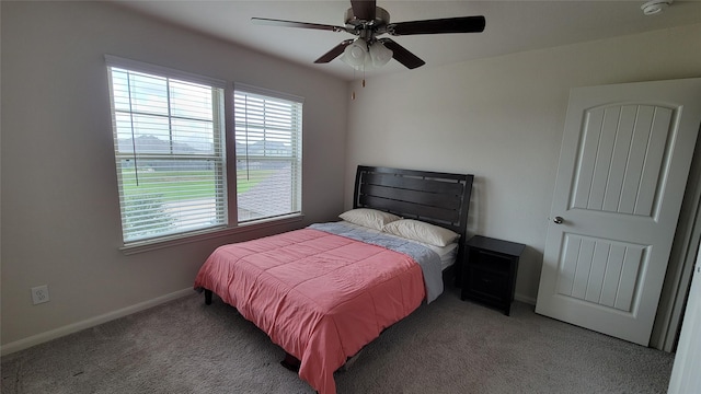 bedroom featuring light carpet and ceiling fan