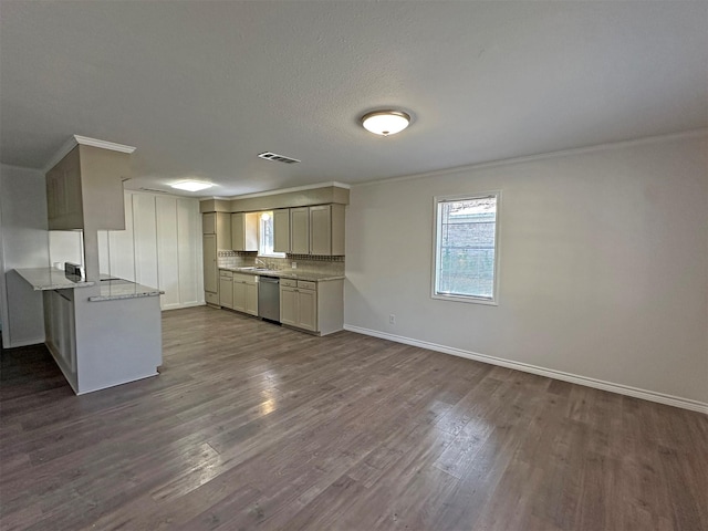 kitchen with stainless steel dishwasher, kitchen peninsula, dark hardwood / wood-style floors, and ornamental molding