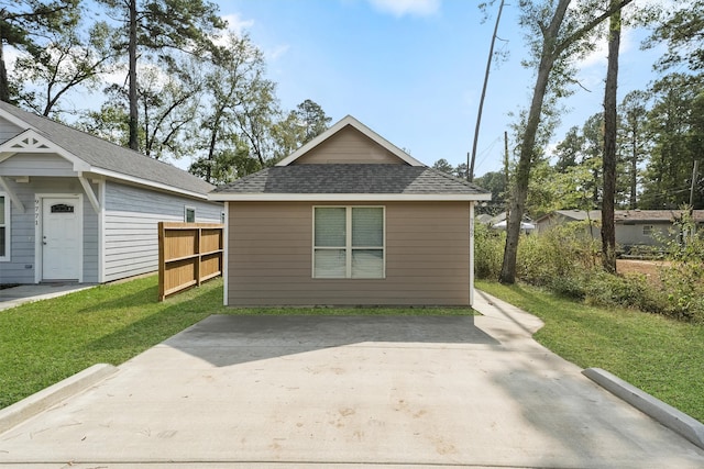 view of property exterior with a yard