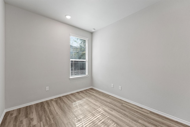 spare room featuring light wood-type flooring