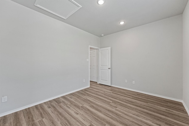 spare room with light hardwood / wood-style flooring