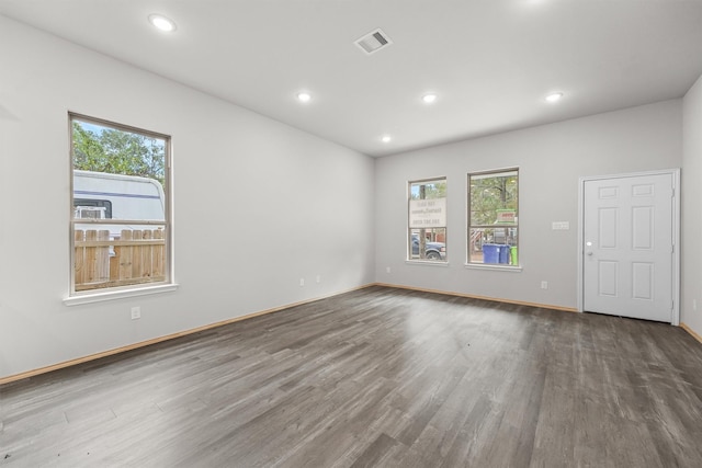 unfurnished room with wood-type flooring