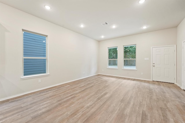 unfurnished room with light hardwood / wood-style flooring