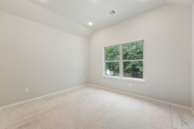 unfurnished room with lofted ceiling