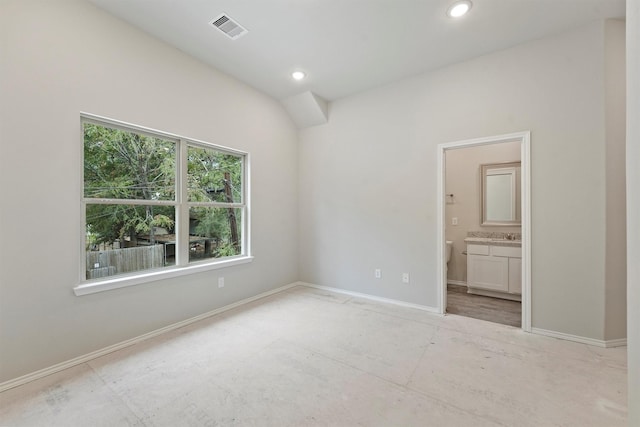 unfurnished bedroom featuring ensuite bathroom