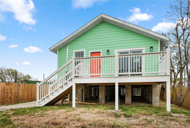 back of property with a wooden deck