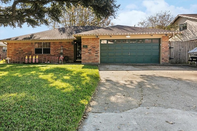 single story home with a front yard and a garage