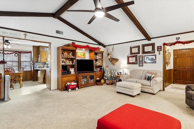 living room with light carpet, ceiling fan, and vaulted ceiling with beams