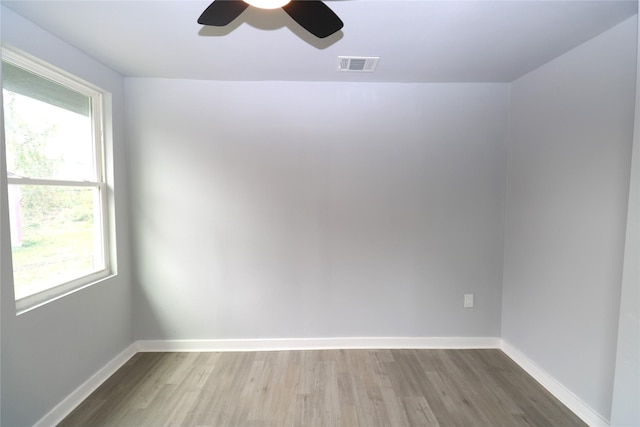 empty room featuring ceiling fan and hardwood / wood-style flooring