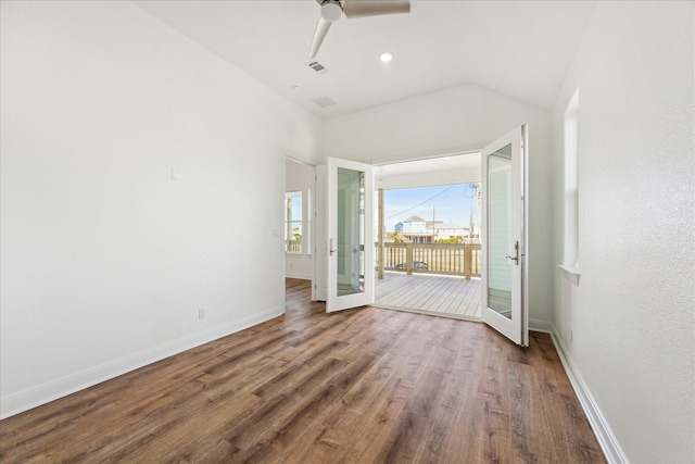 interior space featuring hardwood / wood-style flooring, ceiling fan, and vaulted ceiling