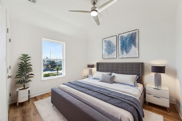 bedroom featuring hardwood / wood-style floors and ceiling fan