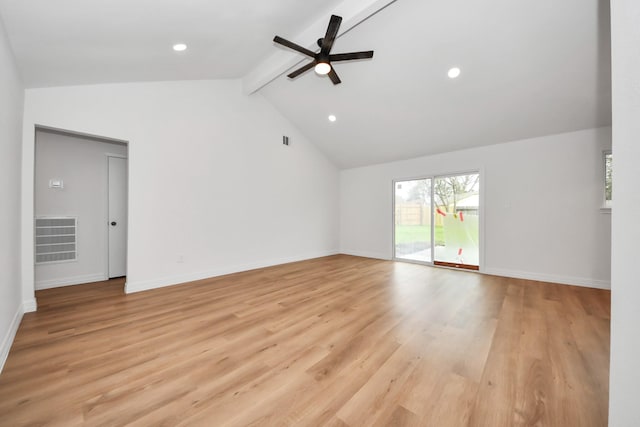 unfurnished room with ceiling fan, lofted ceiling with beams, and light hardwood / wood-style flooring