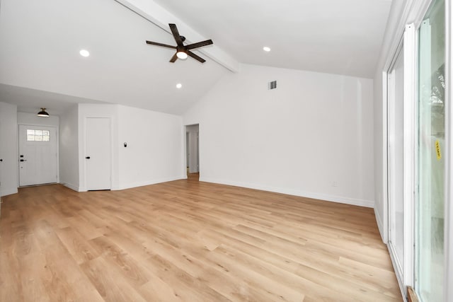 unfurnished living room featuring ceiling fan, light hardwood / wood-style flooring, and vaulted ceiling with beams