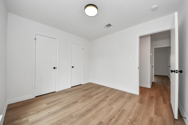 unfurnished bedroom featuring light hardwood / wood-style floors