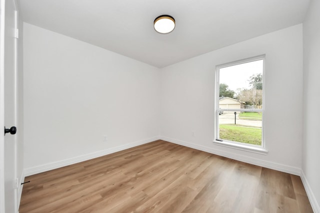 unfurnished room with light hardwood / wood-style floors