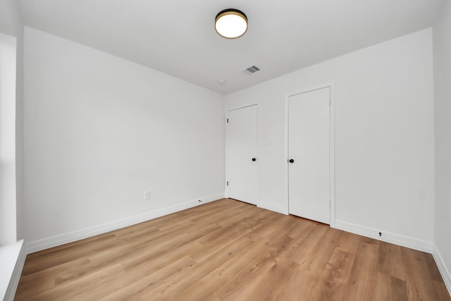 unfurnished bedroom with light hardwood / wood-style floors