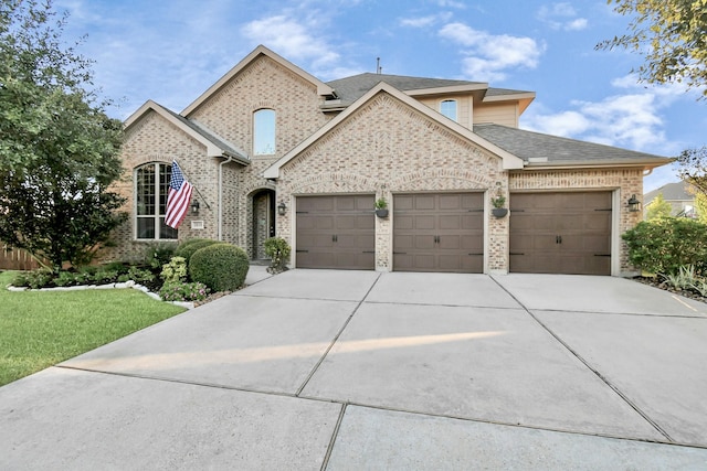 view of front facade with a garage and a front yard