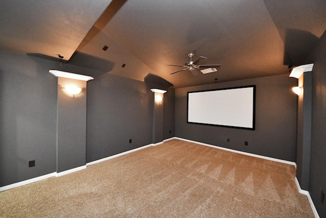 cinema featuring ceiling fan, carpet flooring, and lofted ceiling