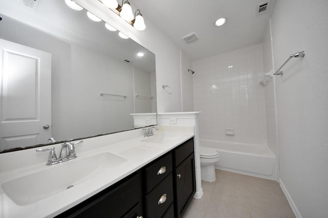 full bathroom with vanity, toilet, tile patterned floors, and tiled shower / bath