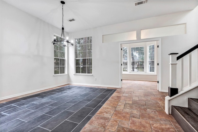 entryway featuring a chandelier