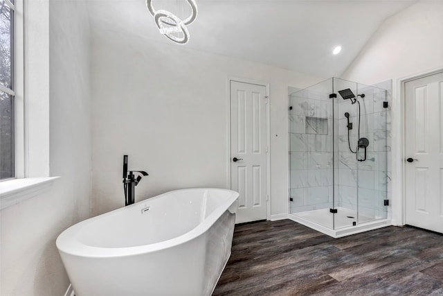 bathroom with lofted ceiling, wood-type flooring, and shower with separate bathtub