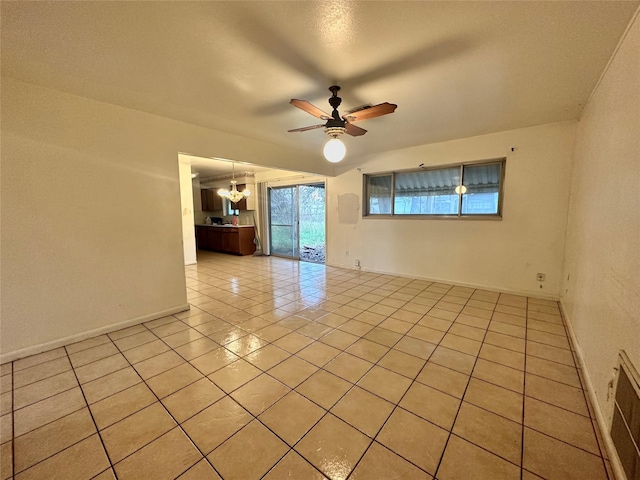 tiled empty room with ceiling fan