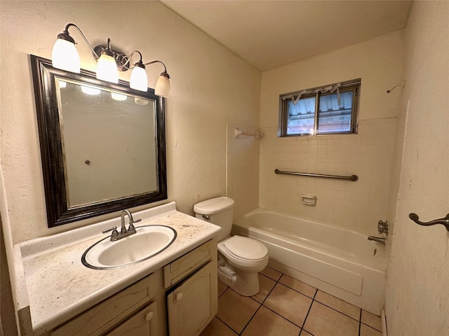 full bathroom with tiled shower / bath, tile patterned floors, vanity, and toilet