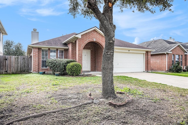 ranch-style house with a garage and a front lawn