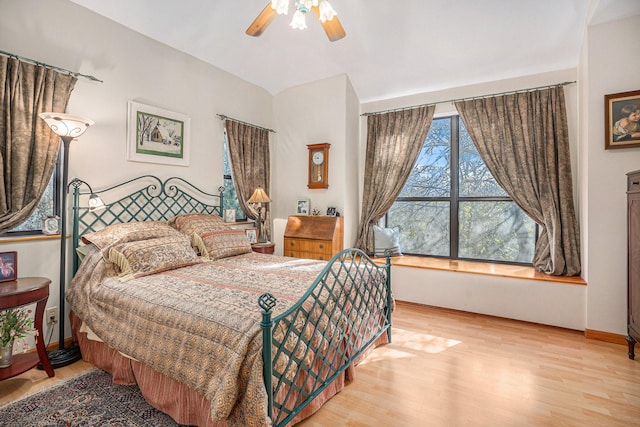 bedroom with ceiling fan and light hardwood / wood-style floors