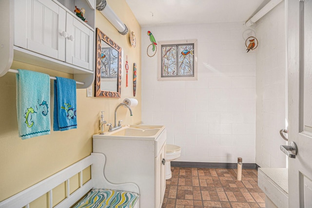 bathroom with toilet and vanity