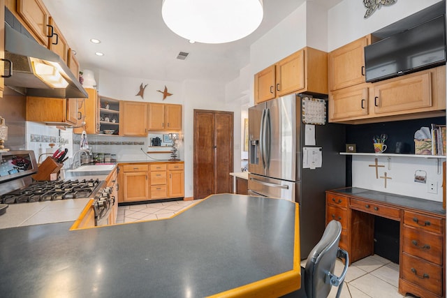 kitchen featuring light tile patterned floors, stainless steel appliances, tasteful backsplash, and sink