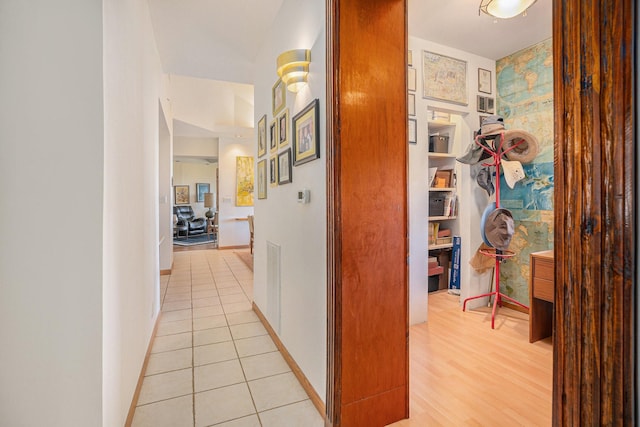 hallway featuring light tile patterned flooring