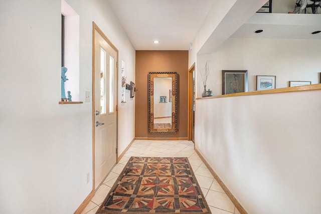 hall featuring light tile patterned flooring