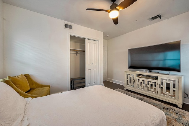 bedroom with ceiling fan, a closet, and dark hardwood / wood-style floors