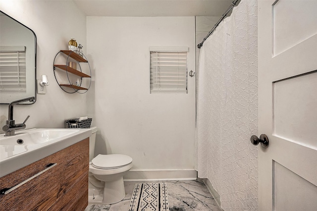 bathroom with toilet and vanity