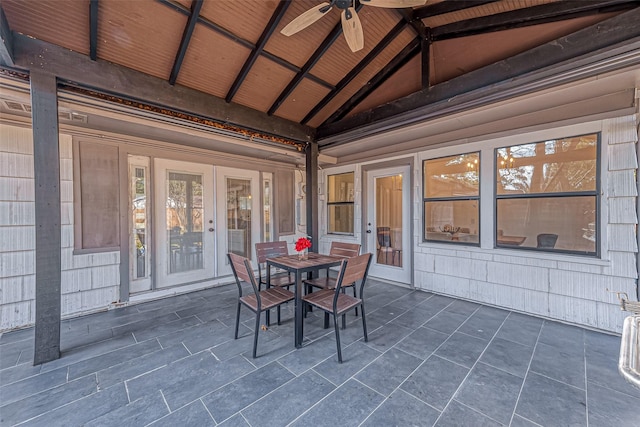 interior space with ceiling fan, lofted ceiling with beams, and wooden ceiling