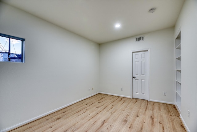 unfurnished room featuring light hardwood / wood-style floors