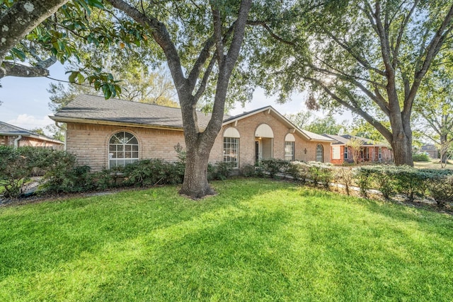 single story home with a front yard